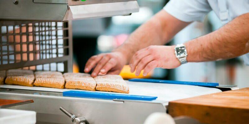 Preparing cookies on production line in confectionery factory food industry How Does Automation Increase